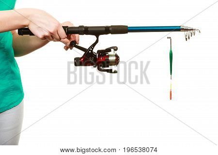 Person Holding Fishing Rod, Spinning Equipment.