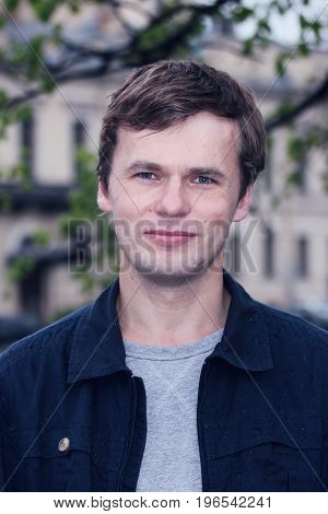 Portrait of young man in St. Petersburg city.