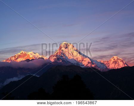 Panorama of mount Annapurna South at sunset - view from Poon Hill on Annapurna Circuit Trek in Nepal Himalaya