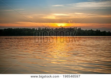 beautiful majestic sunset on the background of the river bank with no people in Dnipro Kiev Ukraine