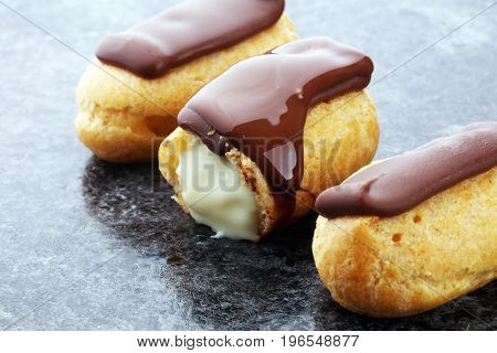 Traditional French Dessert. Eclair With Chocolate Icing. Pastery Concept