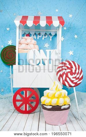 A good cart with the letters one with cakes and sweets