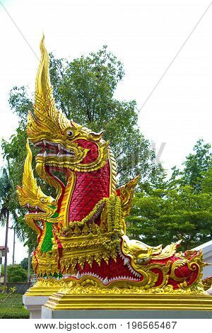 Red Naga sculpture on the stairs of Luang Phor Ngern statue at Wat Paknam Boong Sapang Ubonratchathani.