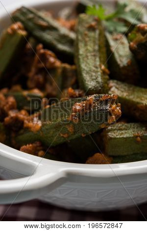 Indian masala fried bhindi or bhendi or Okra or ladyfinger curry or sabji, selective focus