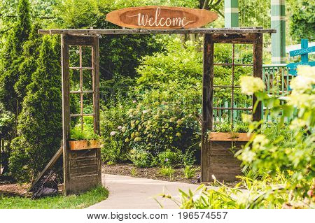 A welcoming entrance to a lush green garden.