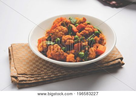 indian spicy food Gobi matar Masala or cauliflower curry with green peas or phool gobi fry, selective focus