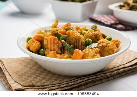 indian spicy food Gobi matar Masala or cauliflower curry with green peas or phool gobi fry, selective focus