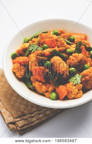 indian spicy food Gobi matar Masala or cauliflower curry with green peas or phool gobi fry, selective focus