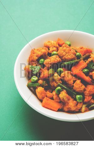 indian spicy food Gobi matar Masala or cauliflower curry with green peas or phool gobi fry, selective focus