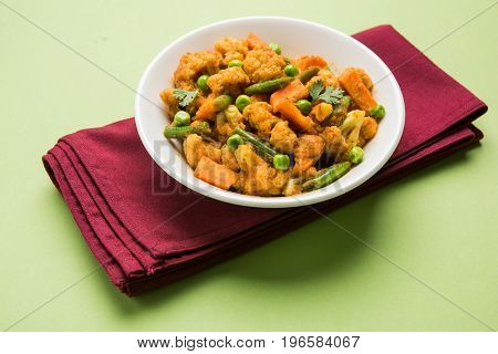 indian spicy food Gobi matar Masala or cauliflower curry with green peas or phool gobi fry, selective focus