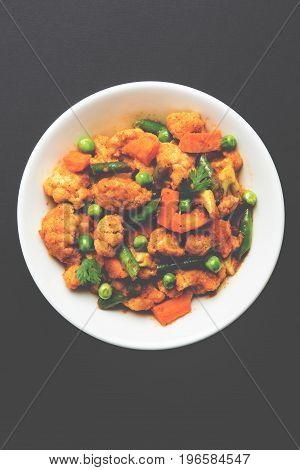 indian spicy food Gobi matar Masala or cauliflower curry with green peas or phool gobi fry, selective focus