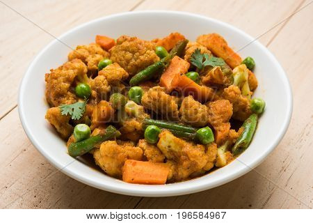indian spicy food Gobi matar Masala or cauliflower curry with green peas or phool gobi fry, selective focus