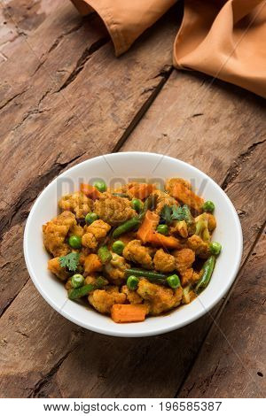 indian spicy food Gobi matar Masala or cauliflower curry with green peas or phool gobi fry, selective focus