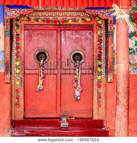Traditional Tibetan doors at Diskit Monastery in Ladakh, Kashmir, India