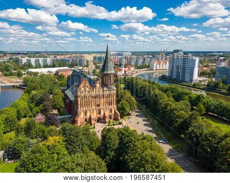 Aerial cityscape of Kant Island in Kaliningrad, Russia at sunny summer day with white clouds in the blue sky