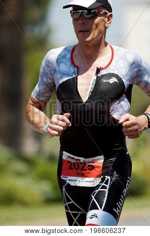 NICE - JULY 27 2017 : IRONMAN Nice 2017. Competitor during the Marathon. Rob BAREL (2025) close to the 15 km point.