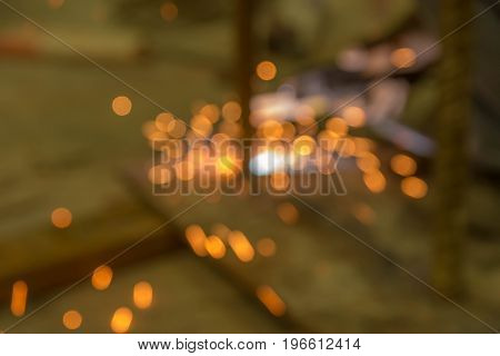 Abstract light background of sparks from welding with bokeh.