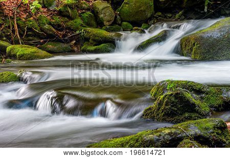 Cascade On The Little Stream With Stones In Forest