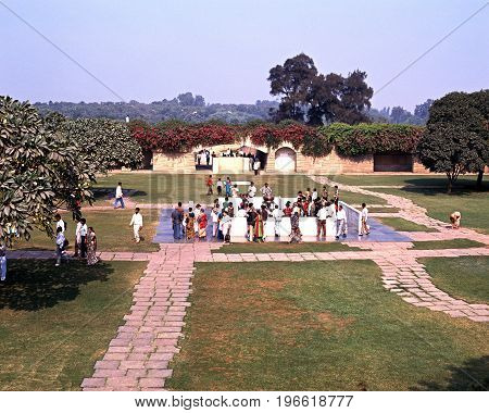 DELHI, INDIA - NOVEMBER 20, 1993 - People in the gardens of the memorial to Mahatma Gandhi Delhi Delhi Union Territory India, November 20, 1993.