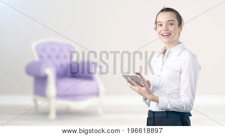 Young Beautiful Business Woman And Creative Designer Standing Over Blured Interior Background