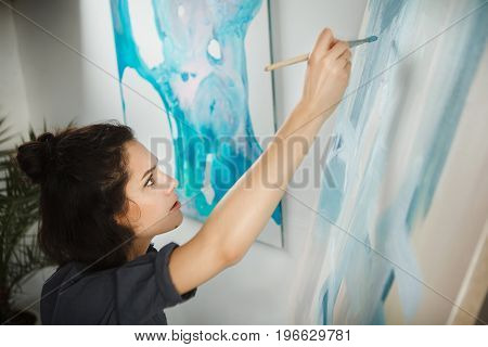 Woman in concept of arts therapy mental health profession uses creative process of art making to improve and enhance physical, mental and emotional well-being