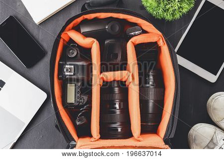 camera gear in bag on top view ready to go travel concept