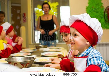 Alchevsk, Ukraine - July 23, 2017: School Cook For Children. Meat Rolls With Cheese Are Prepared.