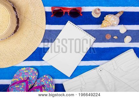 Travel accessories and fashion on blue copy space for travel poster.
