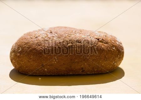 Whole grain bread alone on table, isolated,