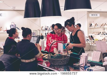 BALI, INDONESIA - JULY 7, 2017: Asian women at shopping mall Sogo, Bali island