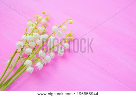 Spring Bouquet Of Lilies Of The Valley On A Pink Wooden Background, Top View