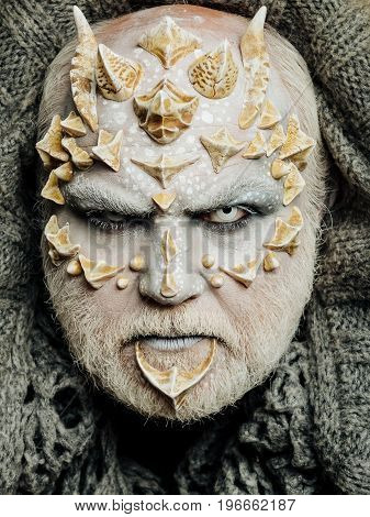 Monster Face With White Eyes, Sharp Thorns And Warts