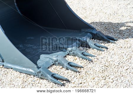 rusty claw of a bulldozer Excavator armup Close With a Back Hoe Close-up of the teeth on a bulldozer scoop. Shallow depth of field.