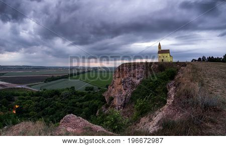 Breathtaking colorful sunset and Drazovce church in Slovakia