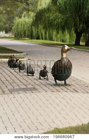 Park near Novodevichy convent in Moscow, Russia, 24 July 2014. Bronze sculpture of mother duck with ducklings, a symbol of peace between Russia and the United States. Author Nancy Shen.
