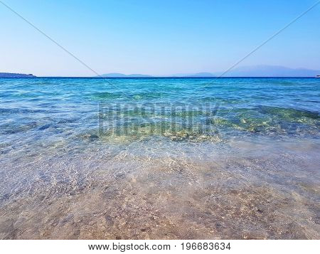Seacoast of Cheshme Turkey. Blue seascape with light waves