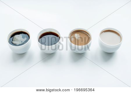 Close-up View Of Different Kinds Of Coffee In Row Isolated On White