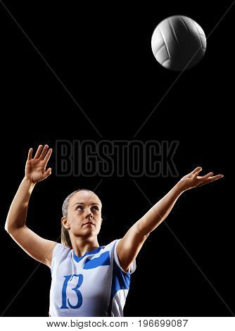 Female professional volleyball player isolated on black background