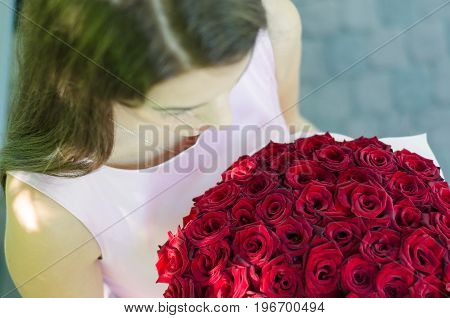 Girl And Flowers Hands And Roses The Girl Is Holding A Bouquet Of Roses Fragment Top View
