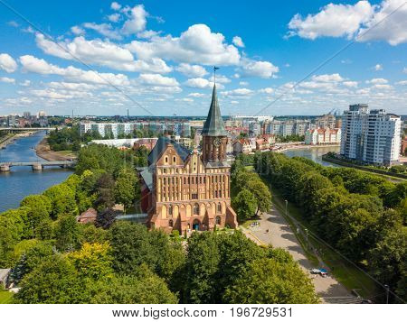 Aerial cityscape of Kant Island in Kaliningrad, Russia at sunny summer day with white clouds in the blue sky