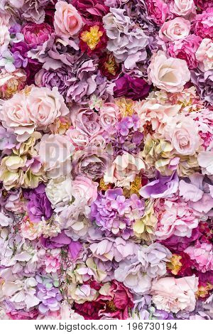Flower texture background for wedding scene. Roses, peonies and hydrangeas, artificial flowers on the wall