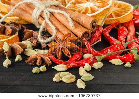 Spices And Herbs On Old Kitchen Table. Food And Cuisine Ingredients.