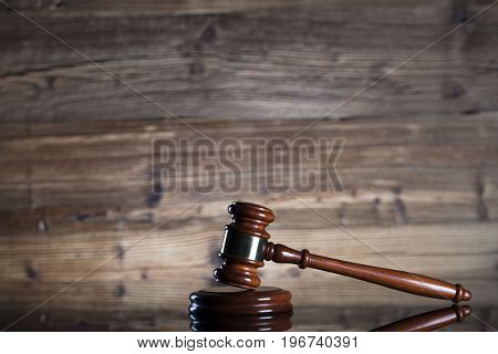 Mallet of the judge. Law. Wooden background.