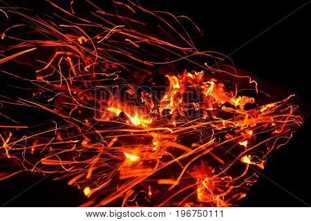 Hot sparking live-coals burning in a barbecue