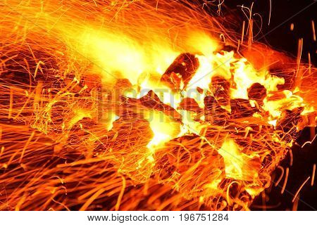 Hot sparking live-coals burning in a barbecue