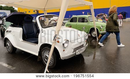 Orel Russia July 22 2017: Dynamica car festival. White cabriolet made from vintage Soviet Zaporozhets car under tent