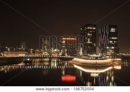 the illuminated Media Harbor in Dusseldorf at night