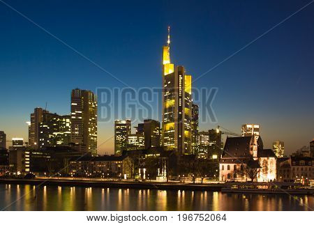 The illuminated skyline of Frankfurt in Germany at night