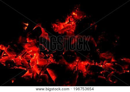 Hot sparking live-coals burning in a barbecue