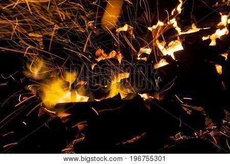 Hot sparking live-coals burning in a barbecue